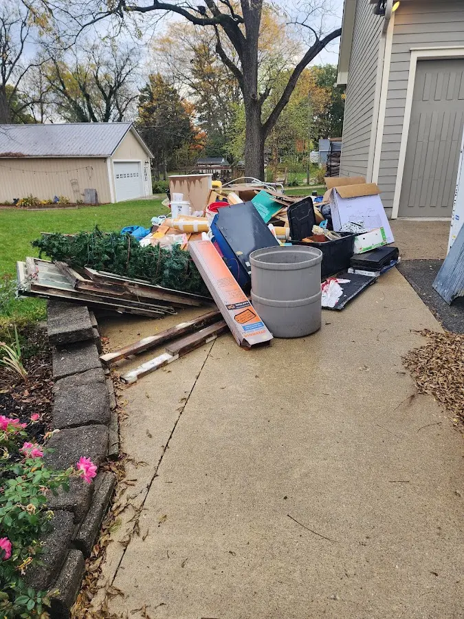 Dumpster being loaded with debris for Residential Dumpster Rental in Apple Valley